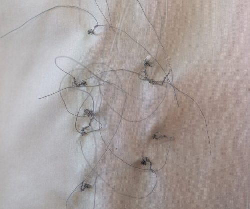 close-up of back of silks with stitching showing