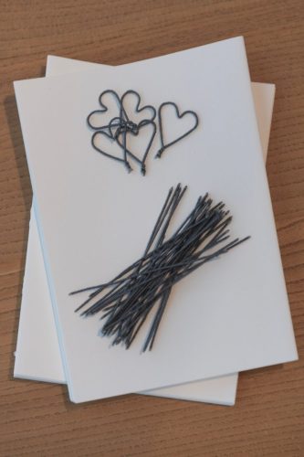 wrapped pipe cleaner hearts and sticks and paper folded ready